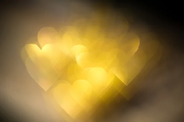 Bokeh en forme de coeur doré — Photo