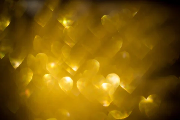 Bokeh en forme de coeur doré — Photo