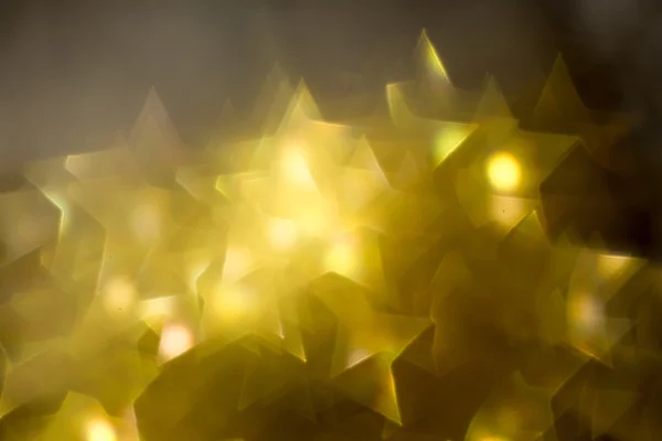 Estrela dourada em forma de bokeh — Fotografia de Stock