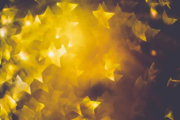 Estrela dourada em forma de bokeh — Fotografia de Stock