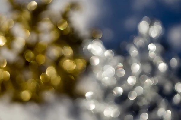 Fiocco di neve sfocato d'oro e d'argento — Foto Stock