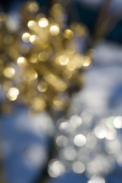 Floco de neve dourado e prateado borrado — Fotografia de Stock