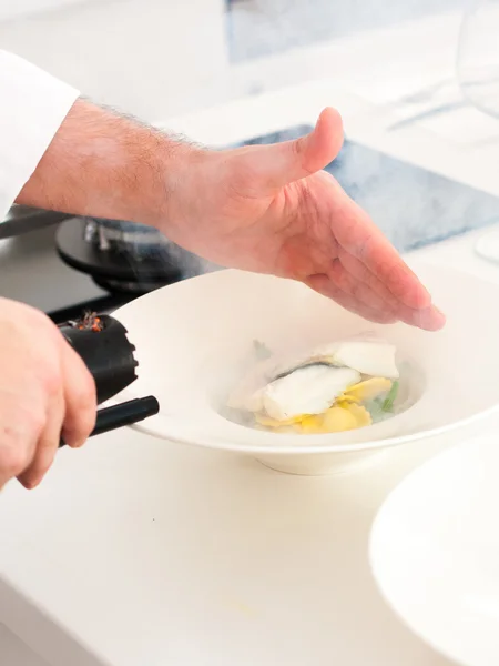 Smoking homemade pasta and fish — Stock Photo, Image