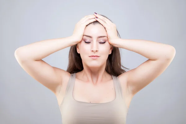 Beautiful young caucasian woman doing face yoga pose — Stock Photo, Image