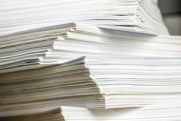 pile of paper documents in the office