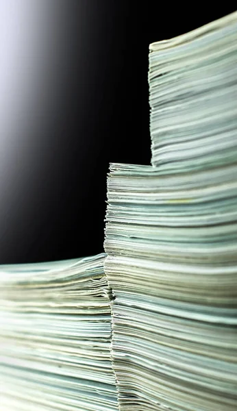 pile of paper documents in the office on black background