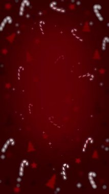 Şeker kamışları, yıldızlar, ağaçlar ve kıvılcımlar kırmızı gradyan arkaplanda dairesel tatil çerçevesinde dizilmiş. Döngü animasyonu. Dikey video.