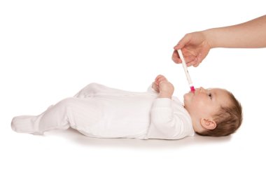 Giving baby medicine clipart