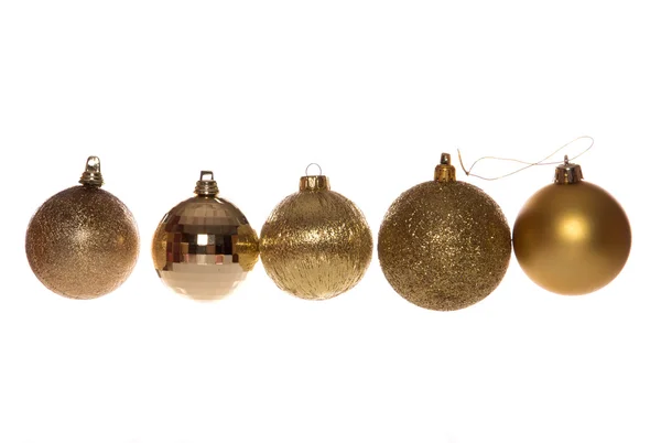 Five gold christmas tree baubles — Stock Photo, Image