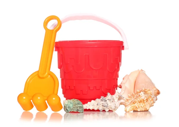Bucket and spade with seashells — Stock Photo, Image