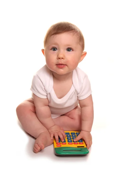 Menina bebê brincando com uma calculadora — Fotografia de Stock