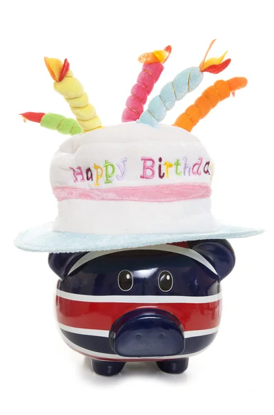 Tirelire portant un chapeau joyeux anniversaire — Photo