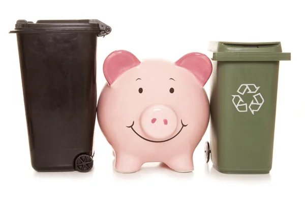 Piggy bank with trash cans — Stock Photo, Image