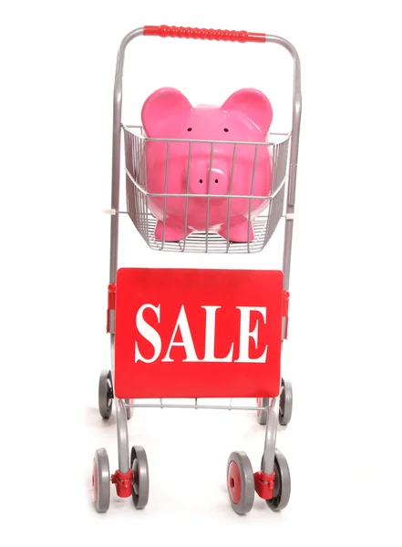 Nákupní vozík s prasátko a nápis-na prodej — Stock fotografie