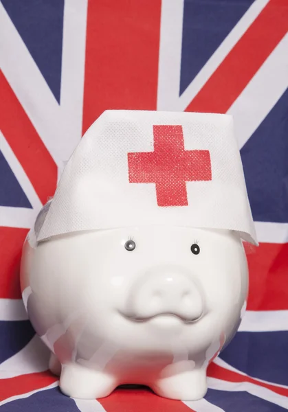 Piggy bank wearing nurse hat — Stock Photo, Image