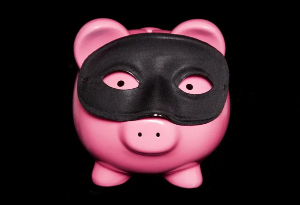 Piggy bank wearing black  mask — Stock Photo, Image