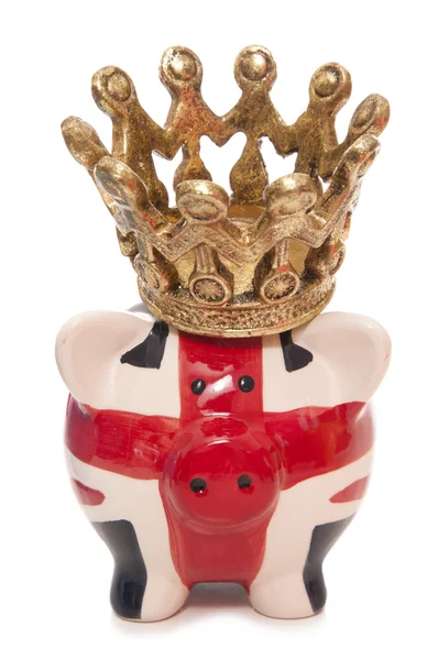 British piggy bank wearing a crown — Stock Photo, Image