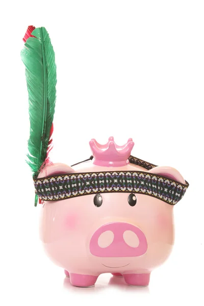 Piggy bank wearing red indian headdress — Stock Photo, Image