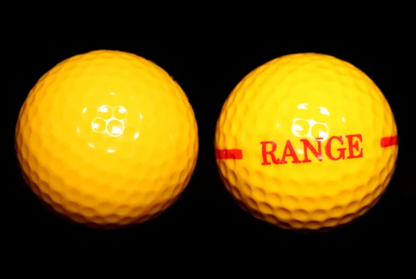 Duas bolas de golfe gama de condução amarela — Fotografia de Stock
