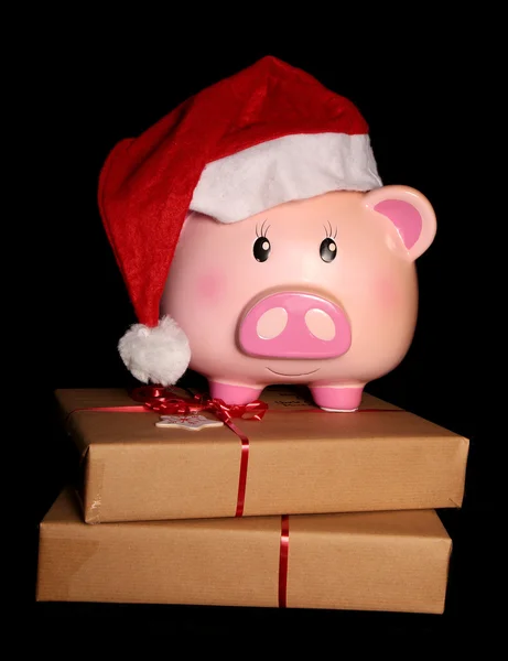 Santa piggy bank and christmas presents — Stock Photo, Image