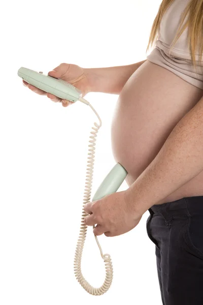 Mulheres usando um doppler em casa em sua barriga grávida — Fotografia de Stock