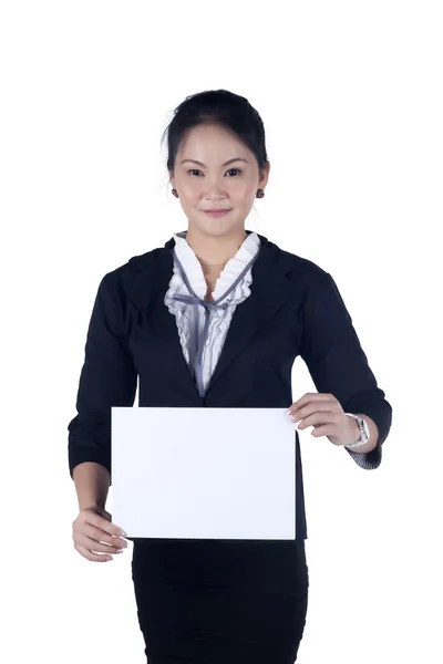 Business woman in black suit holding a blank sign board — Stock Photo, Image