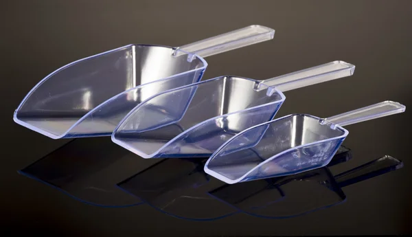 Tres cucharadas transparentes de plástico — Foto de Stock