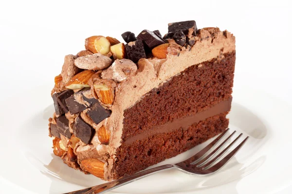 Sweet chocolate cake topping with chocolate and almond nut — Stock Photo, Image