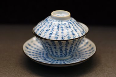 Chinese antique blue and white tea bowl, cover and saucer clipart