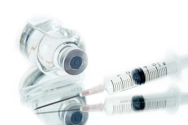 Medical ampoules and syringe — Stock Photo, Image