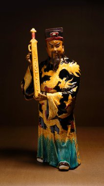 Ancient ceramic statue - Bao QingTian god of justice clipart