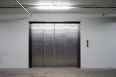 Door of Freight elevators in modern building.  clipart