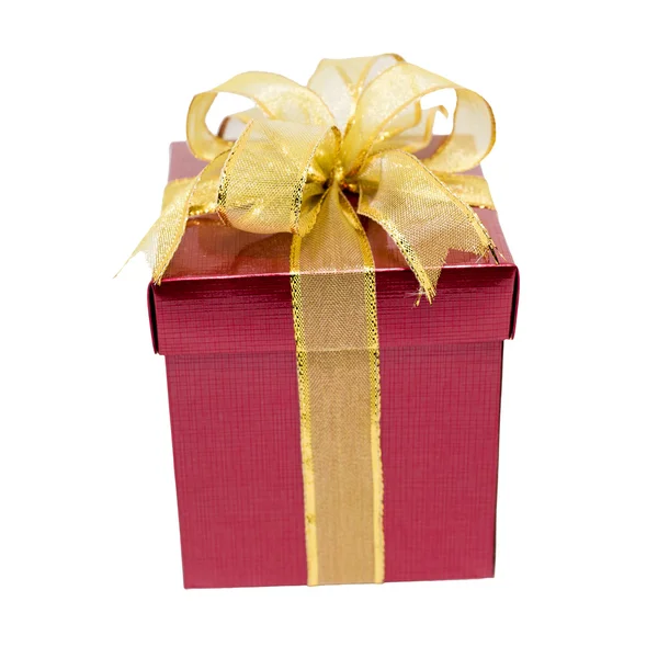 Red gift box with gold ribbon — Stock Photo, Image