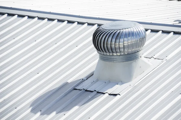 Stainless steel exhaust fan on factory roof