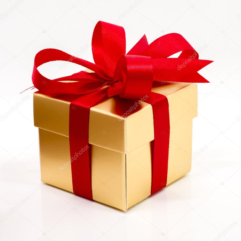 Beautiful gold present box with red bow and ribbons 