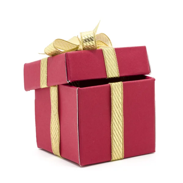 Christmas gift box with a gold ribbon bow — Stock Photo, Image