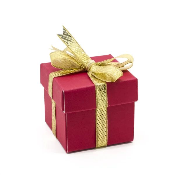 Caja de regalo de Navidad con un lazo de cinta de oro Fotos de stock libres de derechos