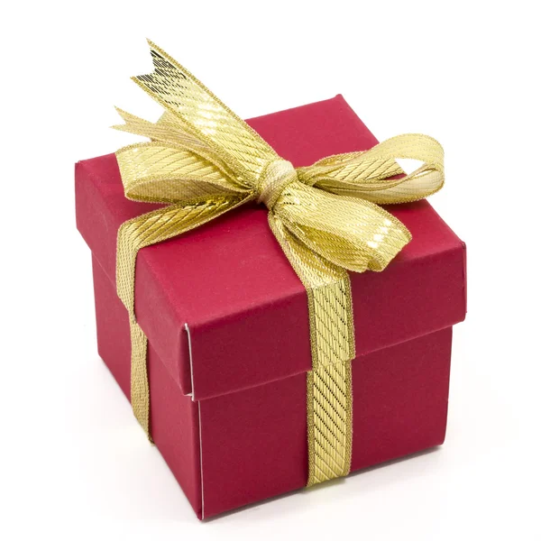 Christmas gift box with a gold ribbon bow Stock Photo