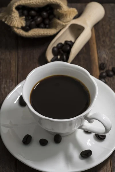 Bodegón taza de café sobre fondo de madera — Foto de Stock