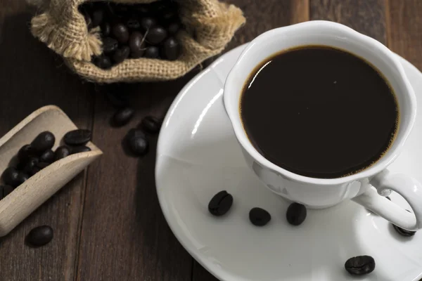 Bodegón taza de café sobre fondo de madera — Foto de Stock