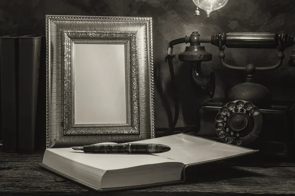 Still life of vintage telephone with picture frame and diary on — Stock Photo, Image