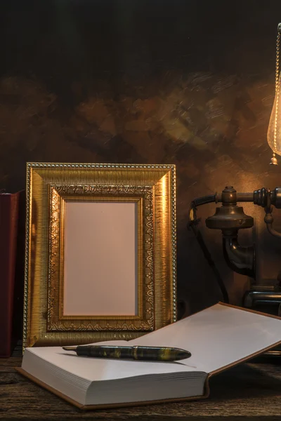 Still life of vintage telephone with picture frame and diary on — Stock Photo, Image