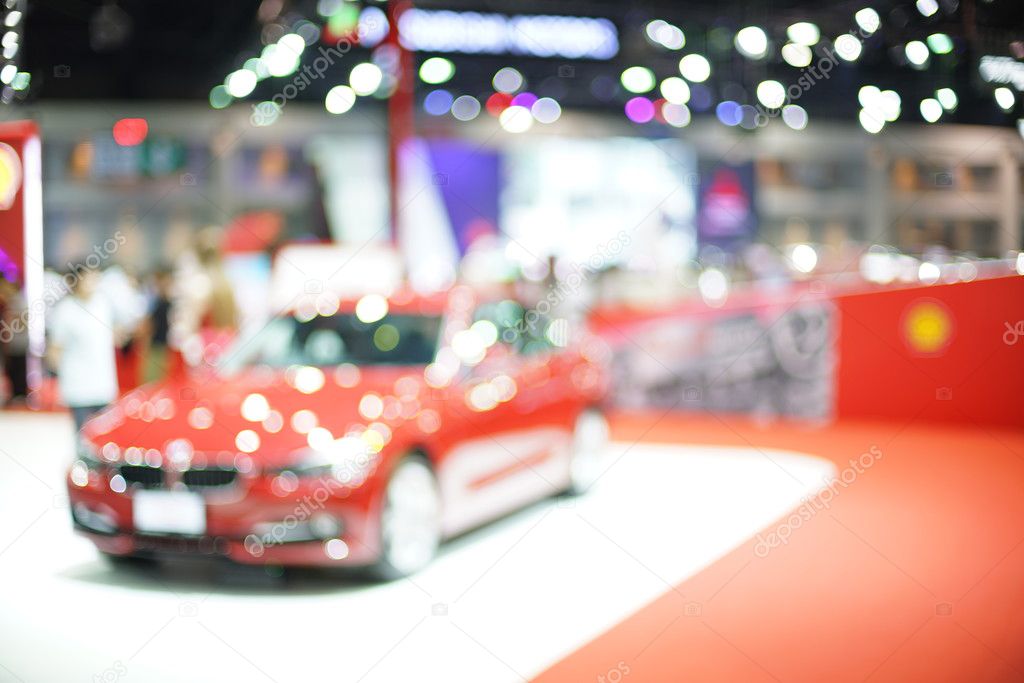 Blurred photo of motor show, background uses
