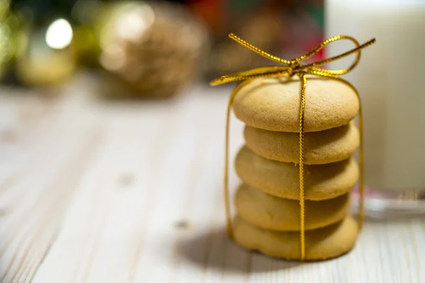 Cookie and milk on wooden table for Santa Claus. — Stock Photo, Image