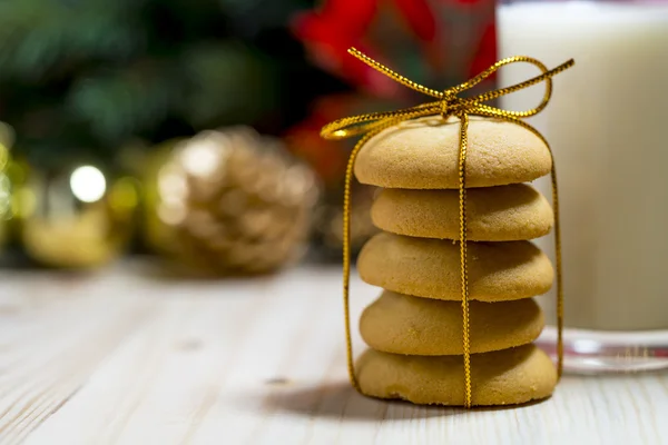 Cookie and milk on wooden table for Santa Claus. — Stock Photo, Image