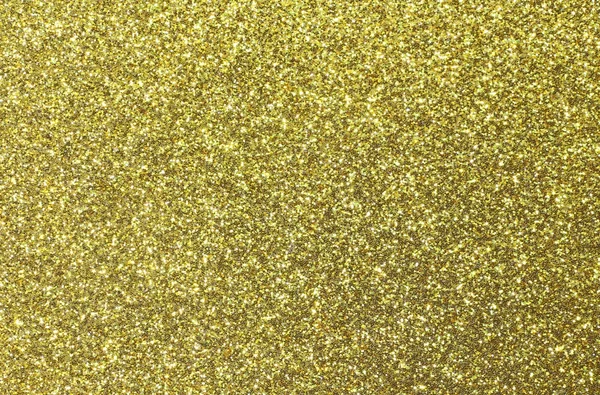 Gyllene glänsande färgade jämnt gult glitter — Stockfoto