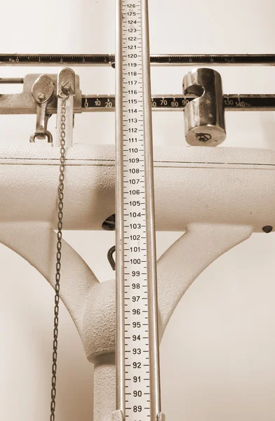 Long measuring rod for measuring the height in an old scale at a — Stock Photo, Image