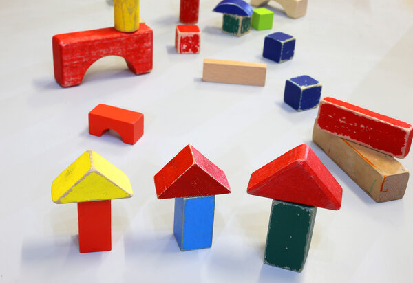 wooden toys and pieces of buildings