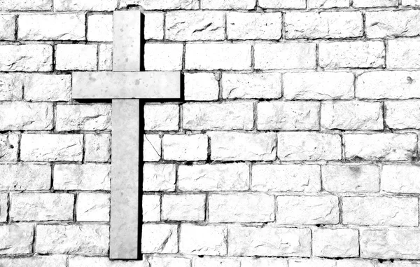 Cross carved on marble attached to the stone wall — Stock Photo, Image