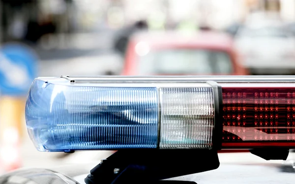 Police patrol car with blue sirens during a traffic control in t — Stock Photo, Image